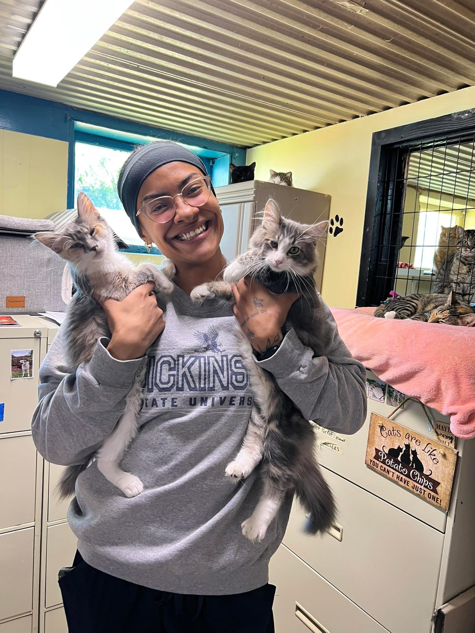 Founder holding cats